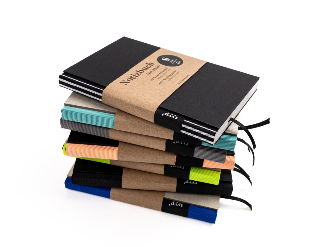 Notizbuch A6 „BerlinBook“ im Stapel, verschiedene Bundfarben, blanko und perforiert, Recyclingpapier