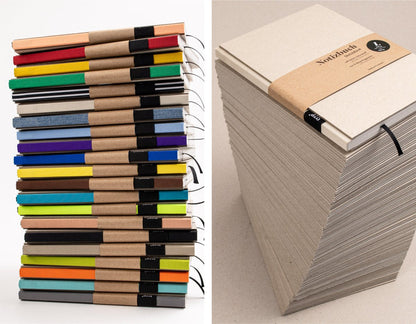 Stapel Notizbücher A5, blanko und perforiert, viele Exemplare für Büro und Teams