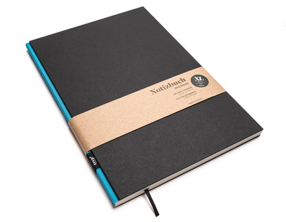 Notizbuch A4 BerlinBook, blanko und perforiert, Einband Schwarz, Bundfarbe Blau