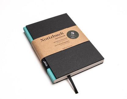 Notizbuch A6 „BerlinBook“ blanko, perforiert, Einband Schwarz | Bundfarbe Maldive