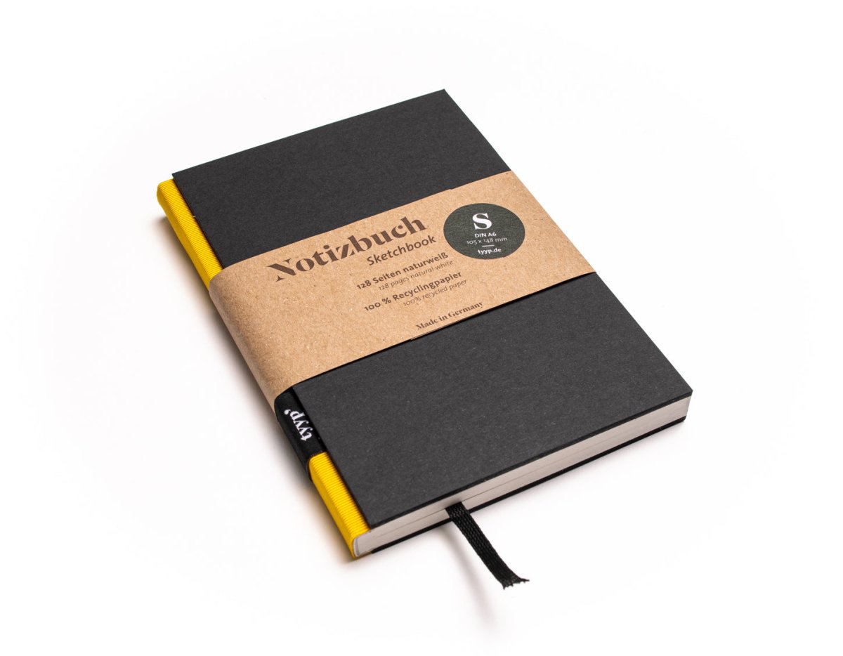 Notizbuch A6 „BerlinBook“ blanko, perforiert, Einband Schwarz | Bundfarbe Gelb